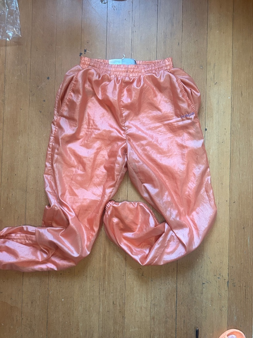 Coral shiny track pants